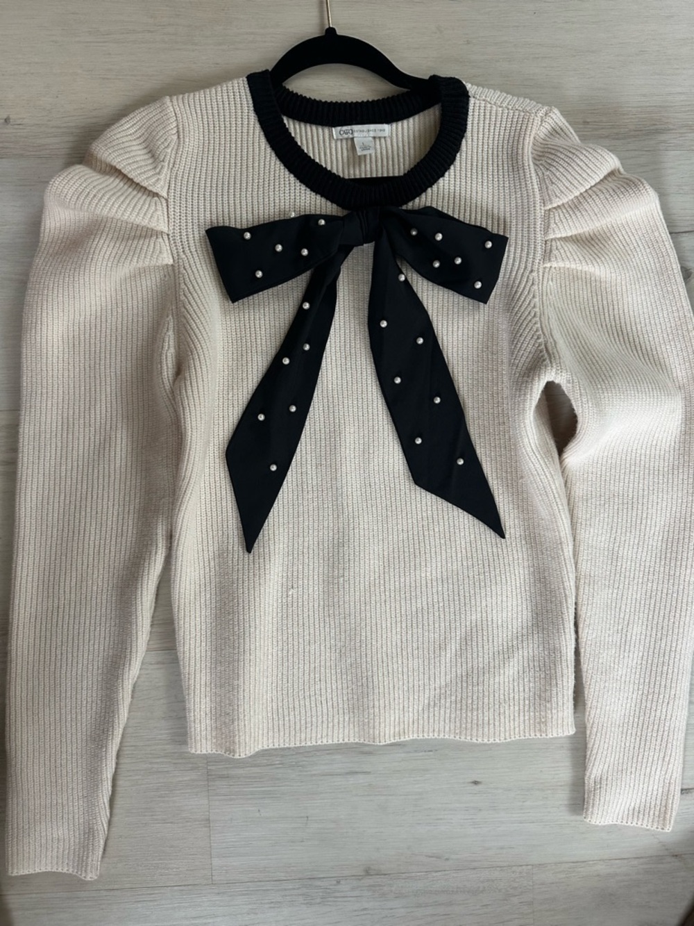 Cream Knit Sweater Top with Black Bow Accent Pearls